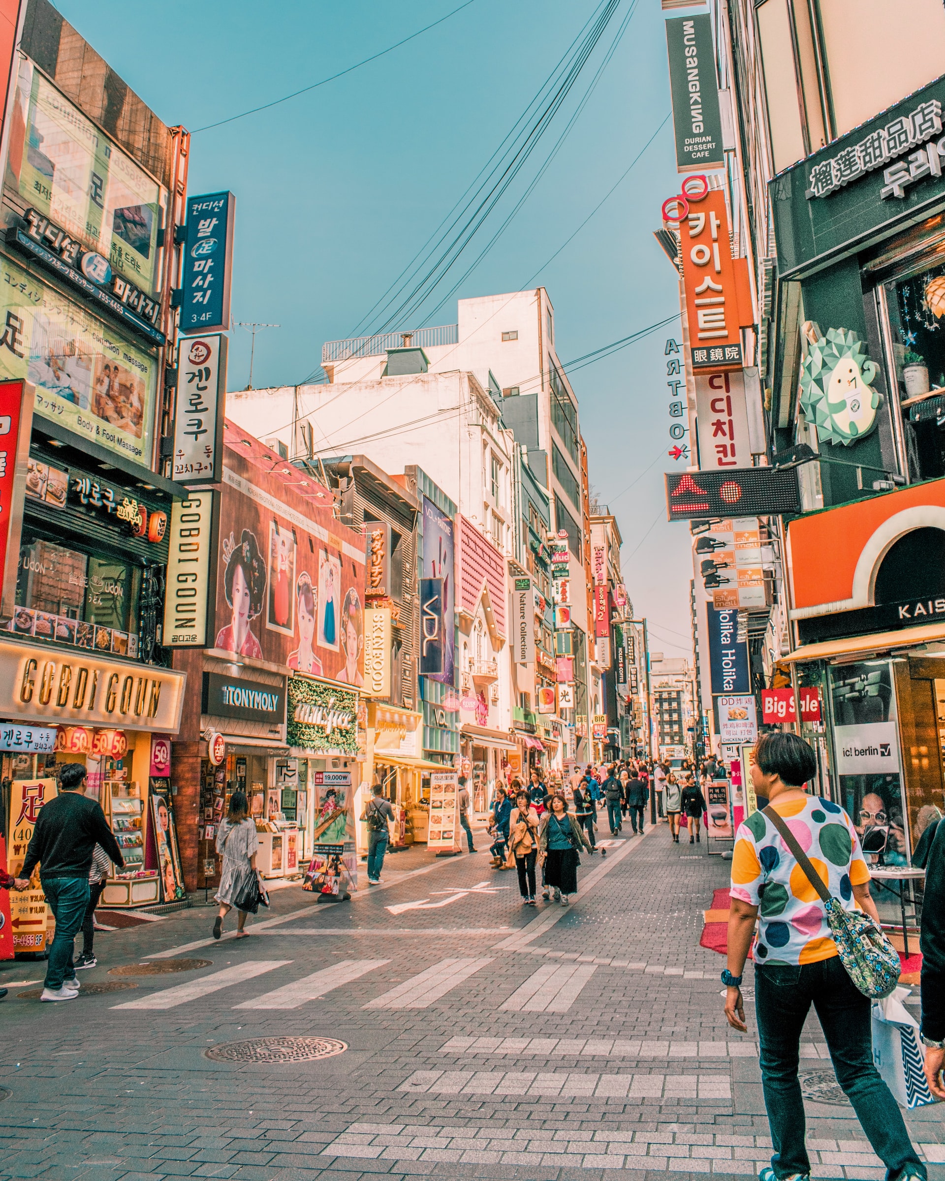 Busy pedestrian street in Myeong-dong, Seoul, by Cait Ellis